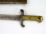 two old swords that are laying on a white surface