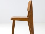 an image of a wooden chair sitting on top of a white floor