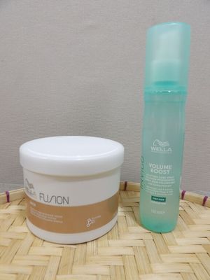 a bottle of lotion and a container of lotion sitting on a table