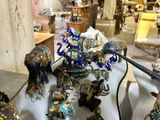 a table with a lot of figurines and other items on it