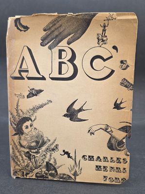 an old book with a picture of a hand and a bird on it