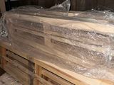 a pile of wood sitting on top of a pile of pallets