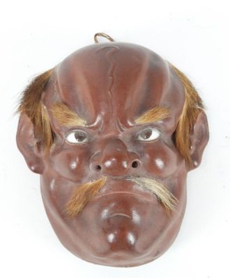 a mask of a man with a mustache on a white background