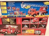 toy fire truck with ladder and ladders in box on white background