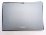 the back of a silver laptop computer sitting on top of a white surface