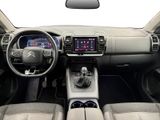 the interior of a car with a steering wheel, dashboard, and dashboard controls