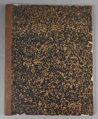 an old book with black and gold speckles on it