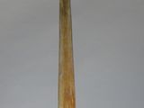a large horn shaped object on a stand on a white surface