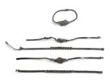 a set of three bracelets on a white background