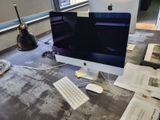a computer on a desk with a keyboard and mouse