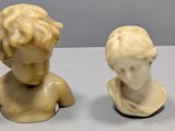 pair of marble busts of a boy and a girl