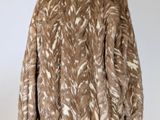 a brown and white jacket on a mannequin mannequin mannequin mannequin mannequin mannequin mannequin mannequin mann