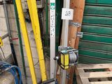 a picture of a forklift in front of a garage door