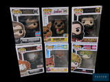 five different funko pop vinyl figures are displayed in a display case