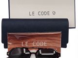a pair of sunglasses sitting on top of a wooden box