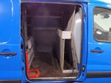 a blue van with a surfboard inside of it