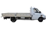a white truck that is parked on the side of the road