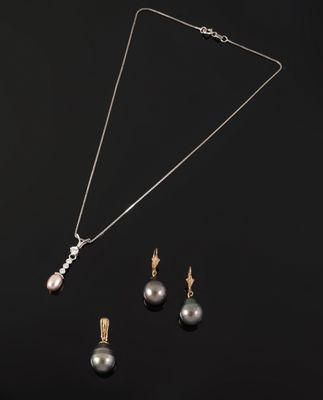 a black pearl and gold necklace and earring set on a black background