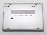 a laptop that is sitting on a white surface