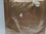 a brown bag with a sheet of facial masks on it
