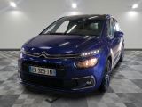 the blue citrole is parked on a checkered tile floor