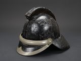 an old helmet with a metal band around the brim of it