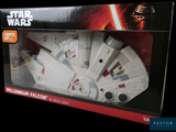 star wars millennium falcon model in a box on a black background