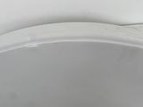 a close up of a white toilet bowl with the lid up