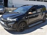 a black suv that is parked in a parking lot