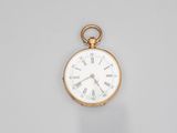 a gold pocket watch with roman numerals and roman numerals on the dial