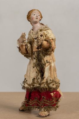 a figurine of a woman holding a cat