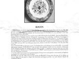an old black and white photo of a plate with flowers on it