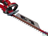a red corded hedger with a black handle and a red handle