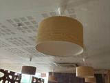 many lamps hanging from the ceiling in this restaurant