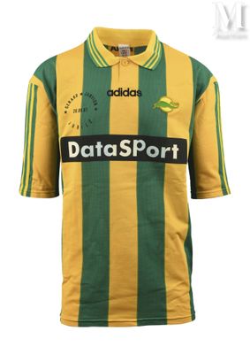 the yellow and green striped shirt is worn by a man