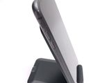a cell phone that is sitting on top of a stand
