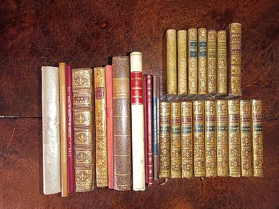 a lot of books that are sitting on a table