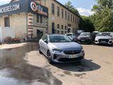 a car parked in front of a building in a parking lot