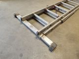 a ladder that is laying on the floor in a room