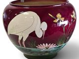 a large vase with a bird painted on it
