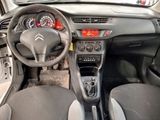 the interior of a car with a steering wheel and dashboard controls