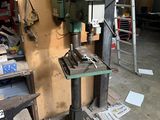 a machine that is sitting on a table in a garage