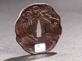 a small piece of metal that has a design on it