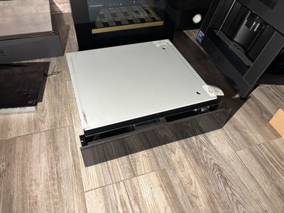 an image of a laptop computer sitting on top of a wooden floor