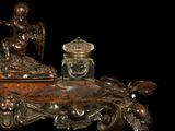 a statue of an angel sitting on top of a table