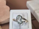 a ring that is sitting in a box on a table