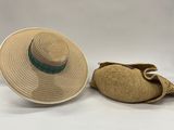 two hats and a bag are sitting on a white surface