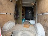 an image of the inside of a moving truck with the door open