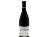 a bottle of wine that is sitting on a table