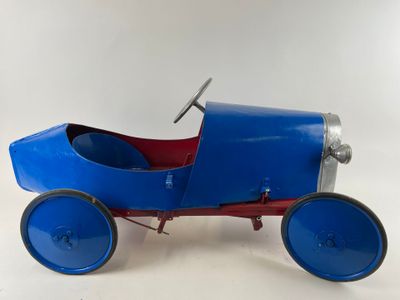 a blue toy car sitting on top of a white surface
